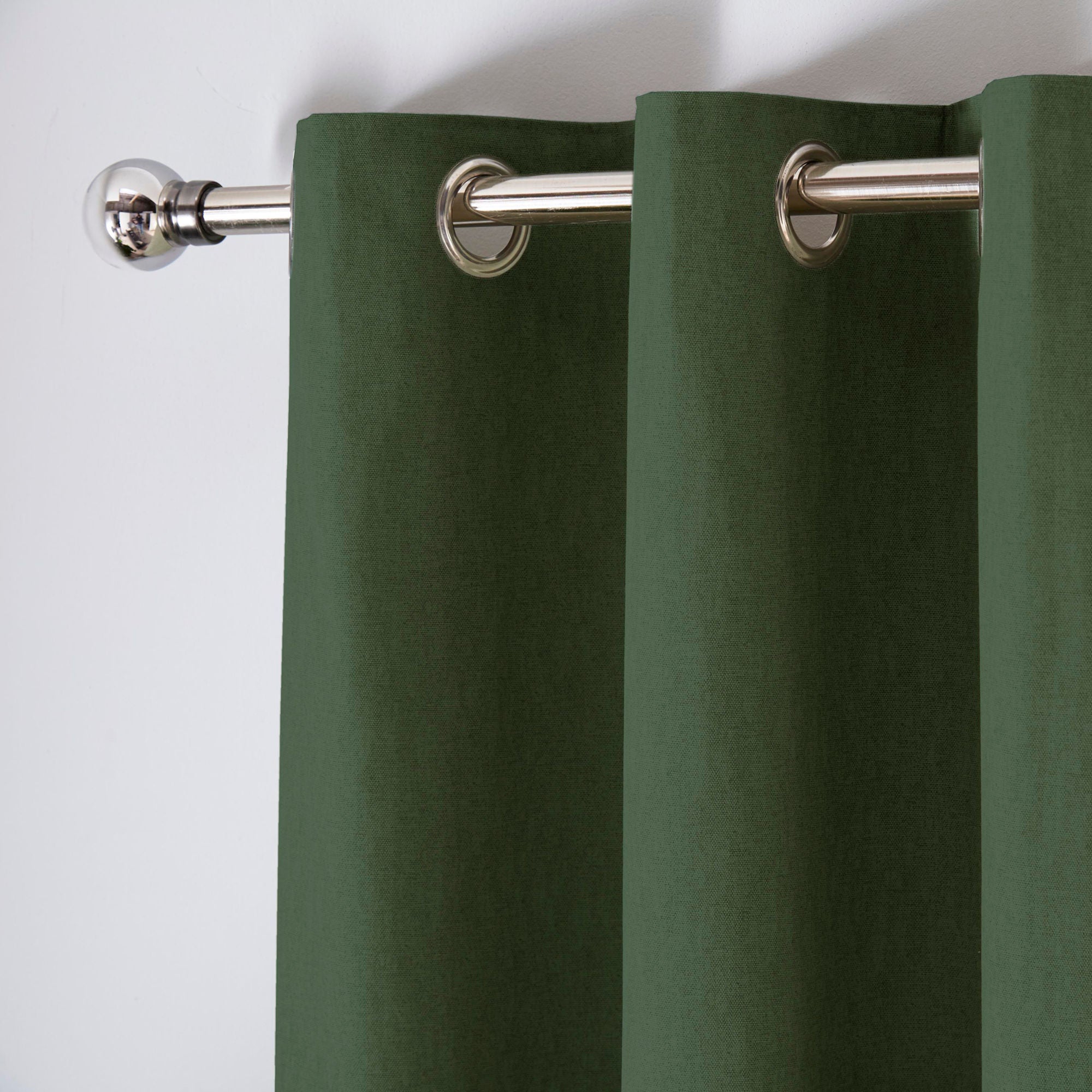 Pair of Eyelet Curtains Cannes by Fusion in Bottle Green