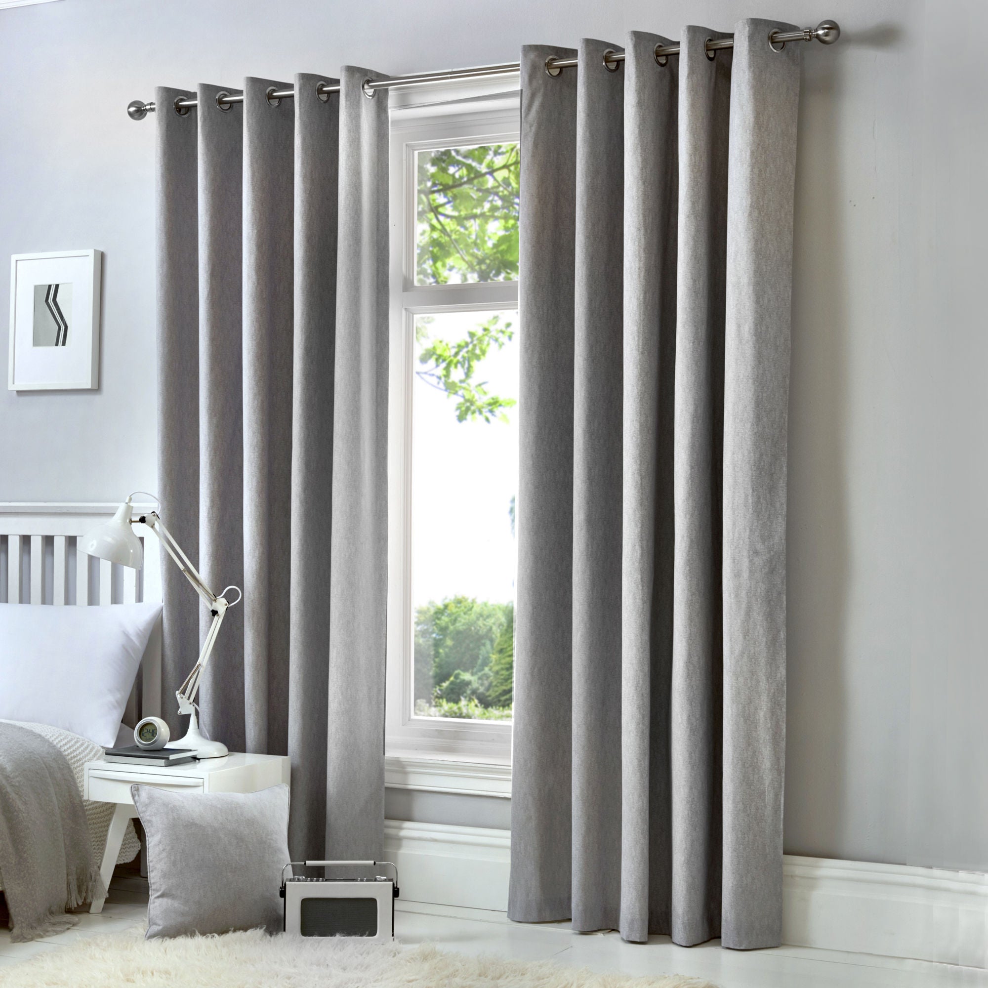 Pair of Eyelet Curtains Cannes by Fusion in Silver