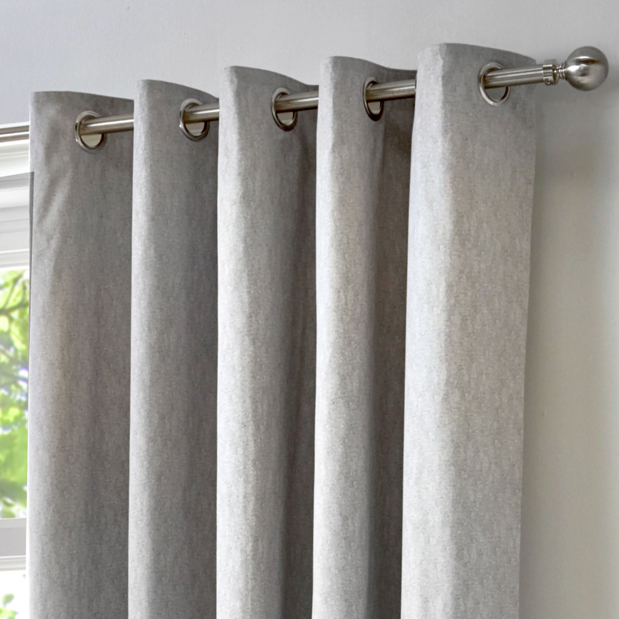 Pair of Eyelet Curtains Cannes by Fusion in Silver