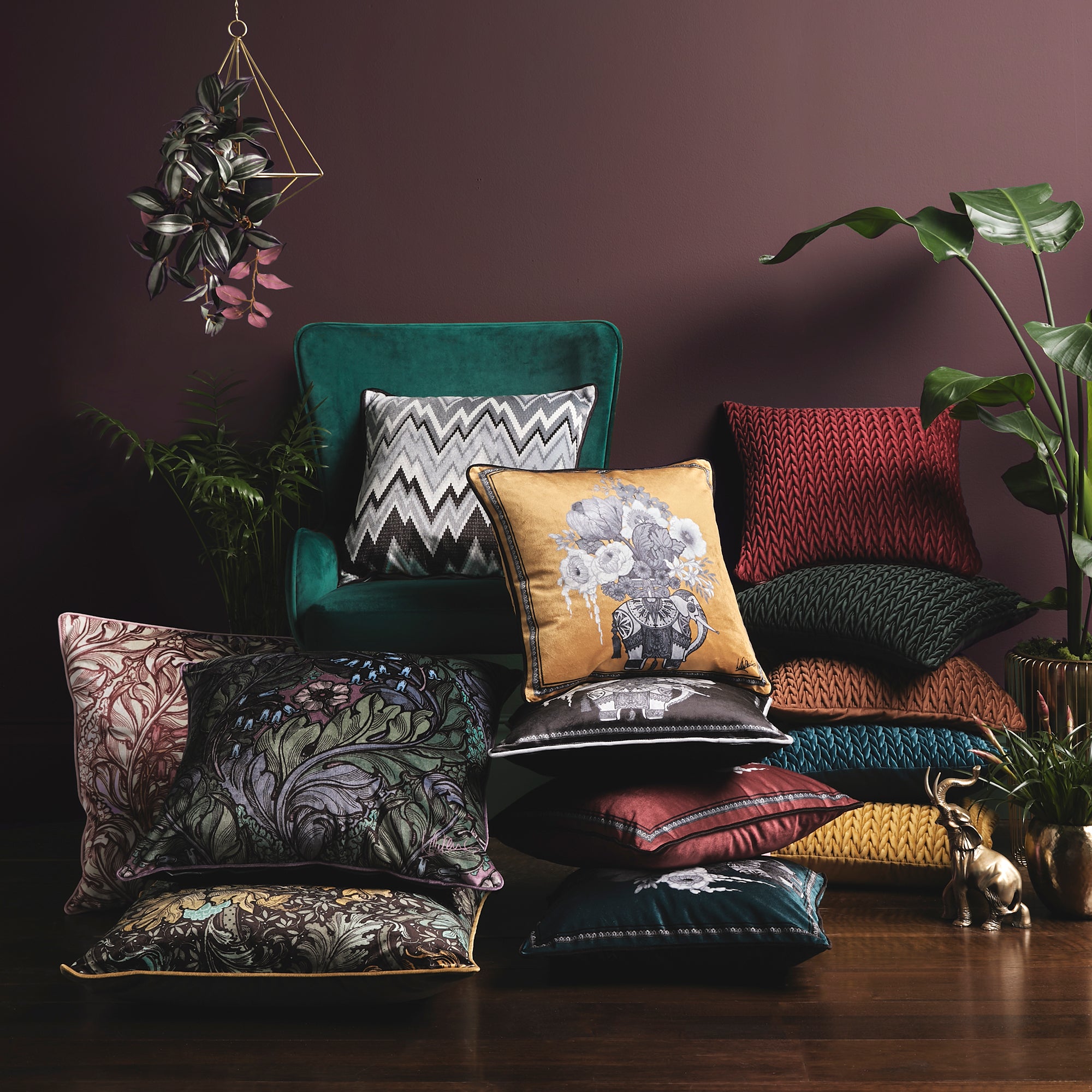 Filled Cushion Rambleicious by Laurence Llewelyn-Bowen in Claret