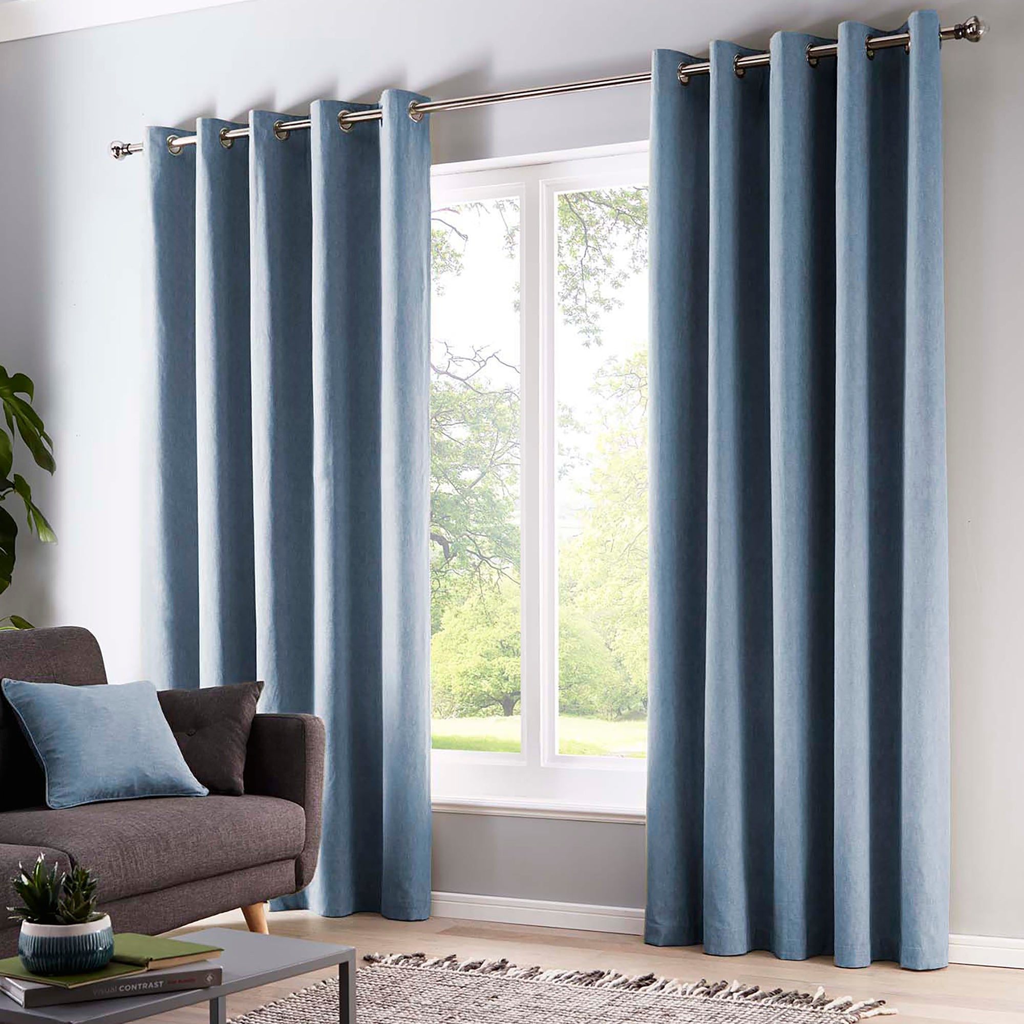 Pair of Eyelet Curtains Sorbonne by Fusion in Light Blue