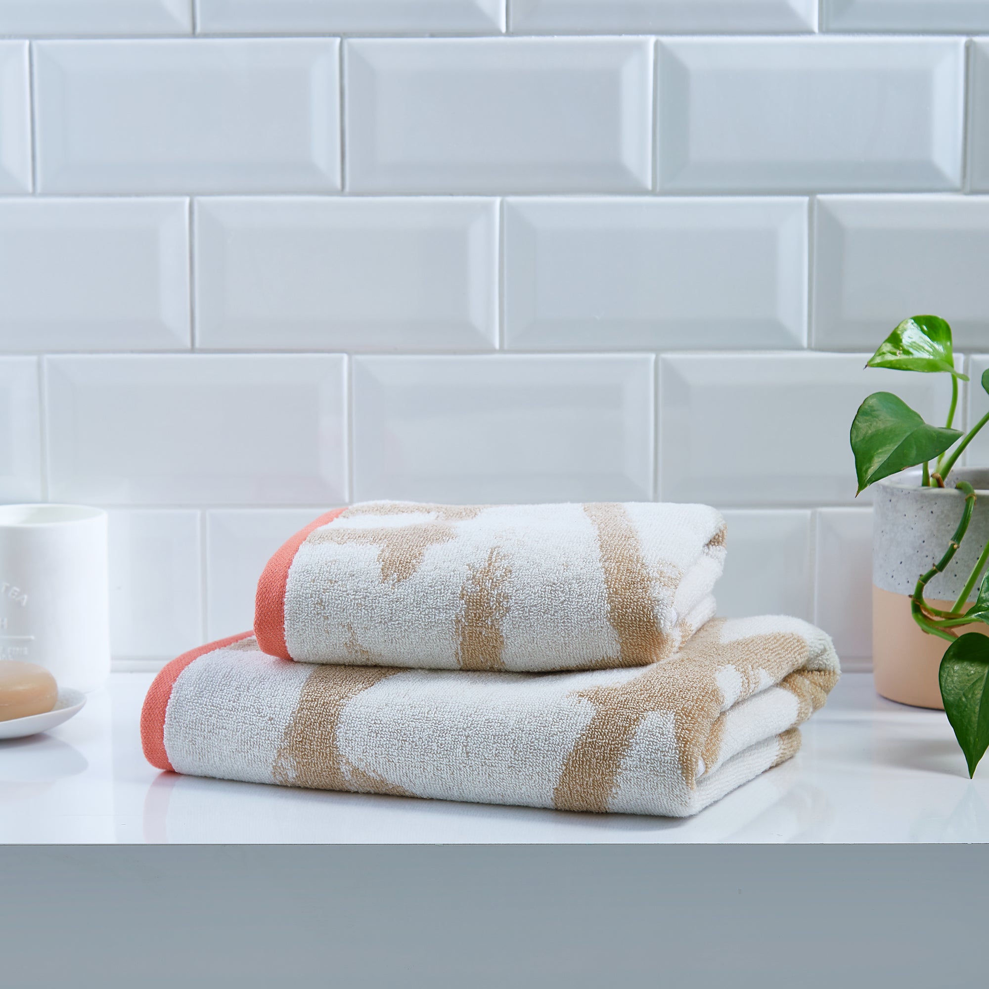 Leda Hand and Bath Towels by Fusion Bathroom in Natural/Coral