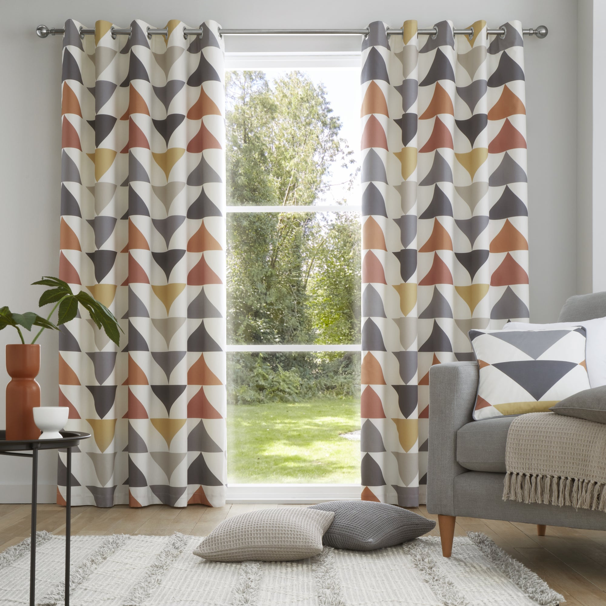 Pair of Eyelet Curtains Brodrick by Fusion in Spice/Ochre