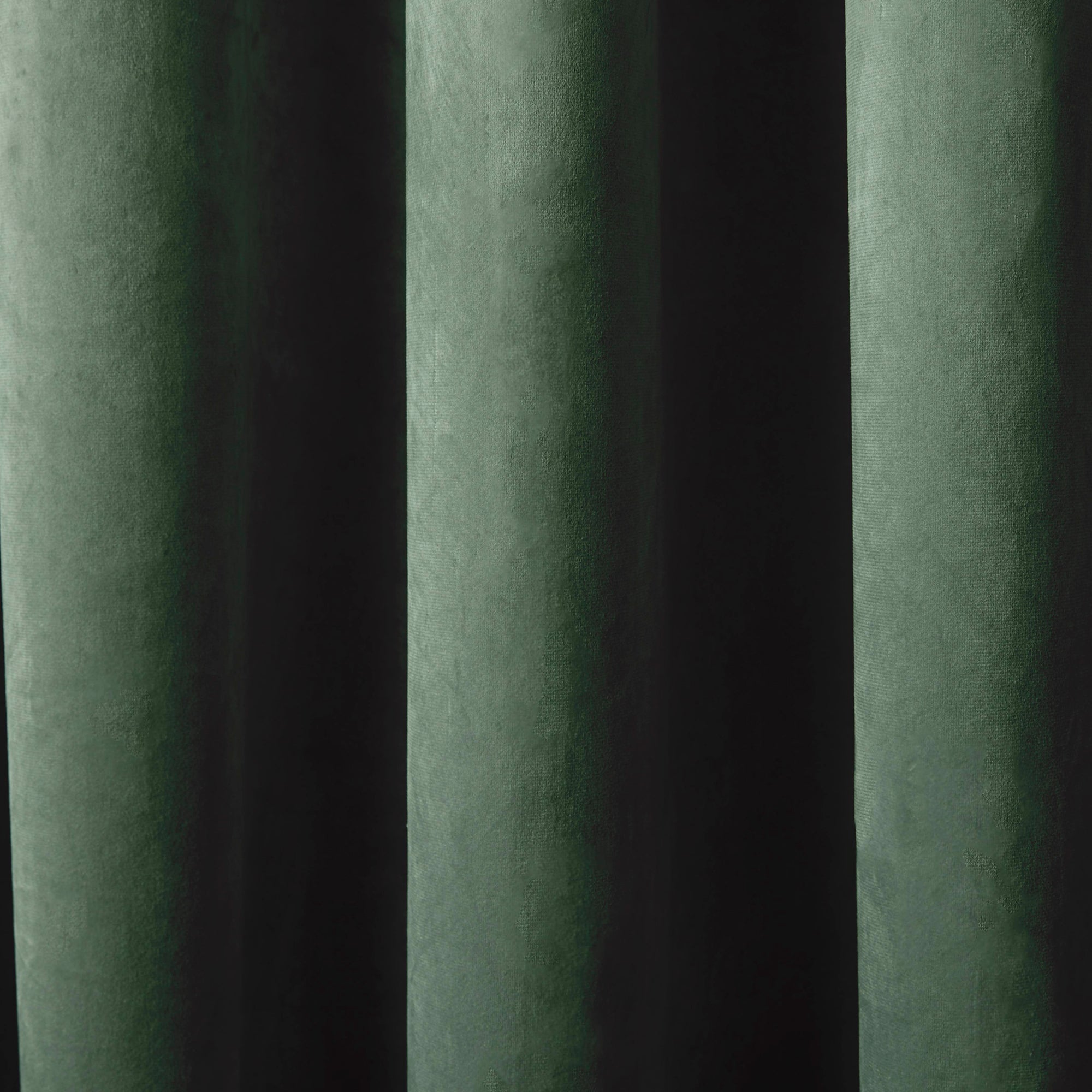 Montrose -  Blackout Velvet Eyelet Curtains in Bottle Green - by Laurence Llewelyn-Bowen
