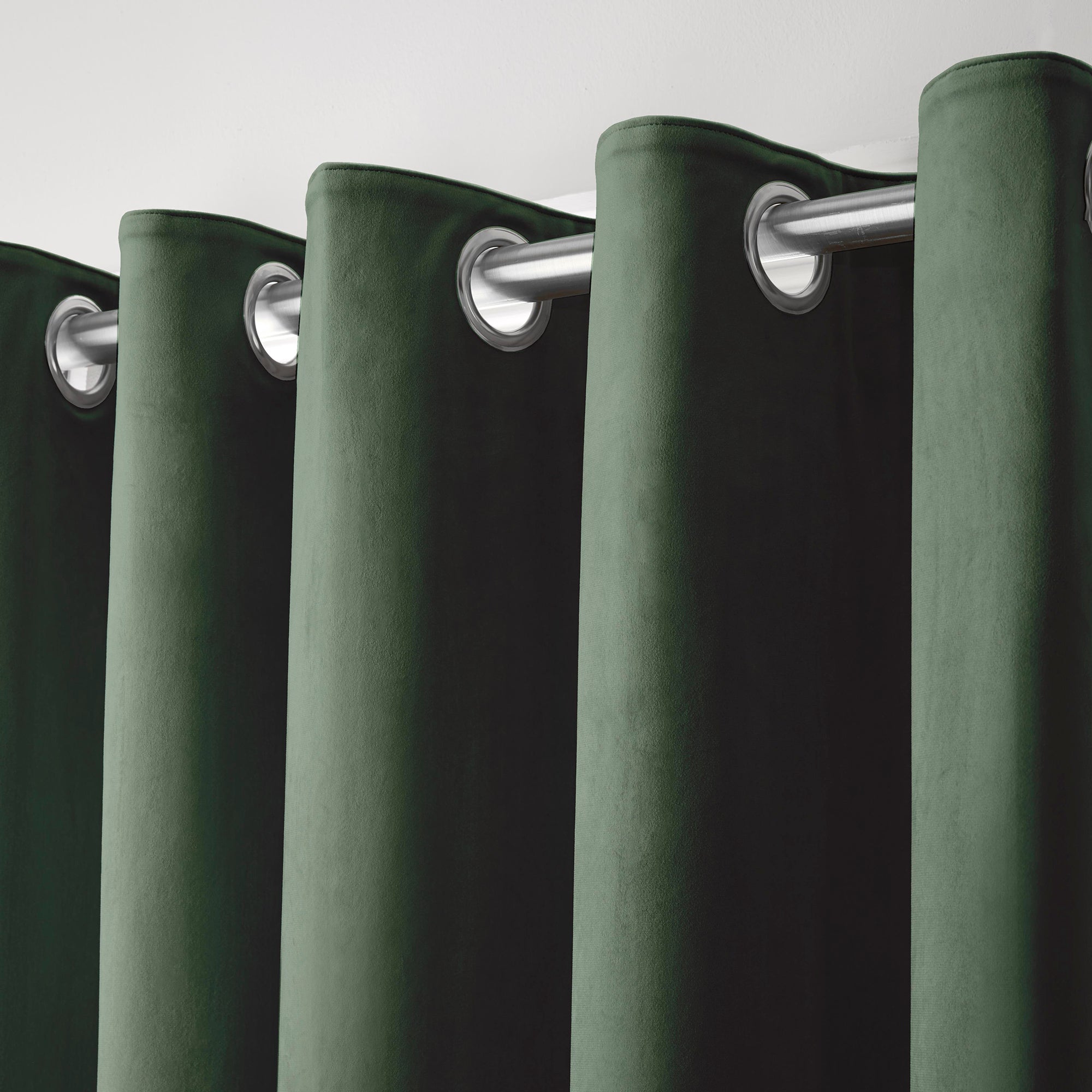 Montrose -  Blackout Velvet Eyelet Curtains in Bottle Green - by Laurence Llewelyn-Bowen