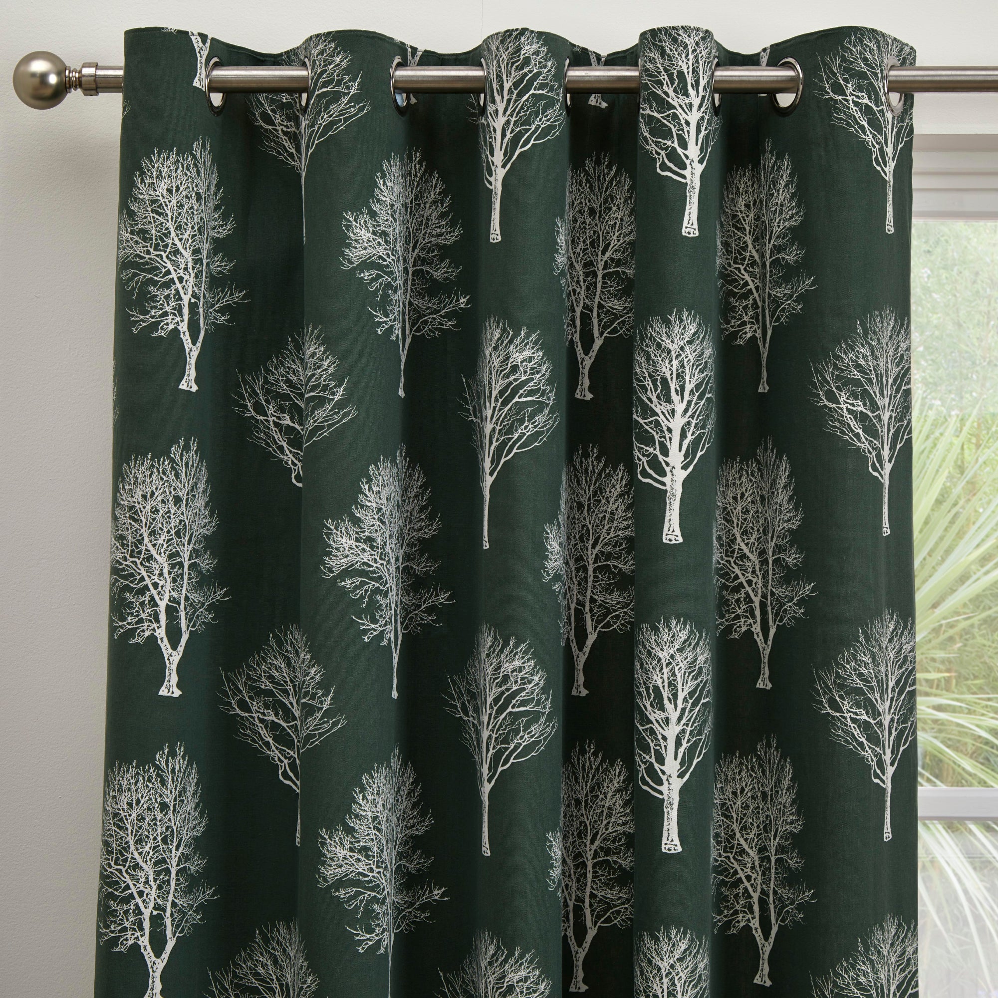 Pair of Eyelet Curtains Woodland Trees by Fusion in Bottle Green